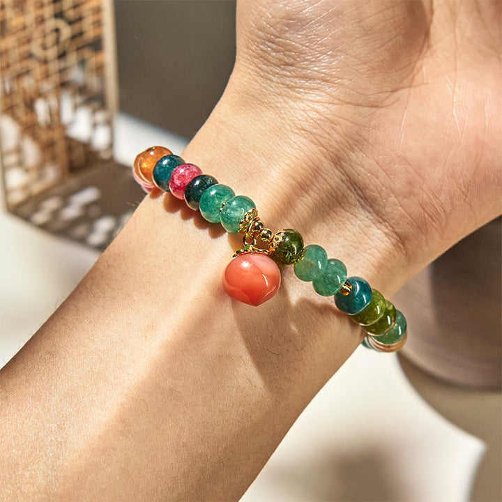 Pulsera positiva de melocotón con Buddha Stones