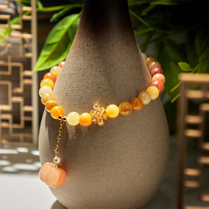 Pulsera de la riqueza con calabaza y anudado chino de jade y seda dorada con Buddha Stones