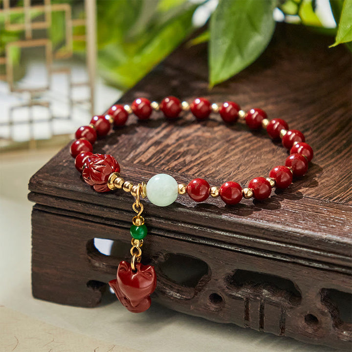 Pulsera con dije de zorro adorable de loto cinabrio y Buddha Stones