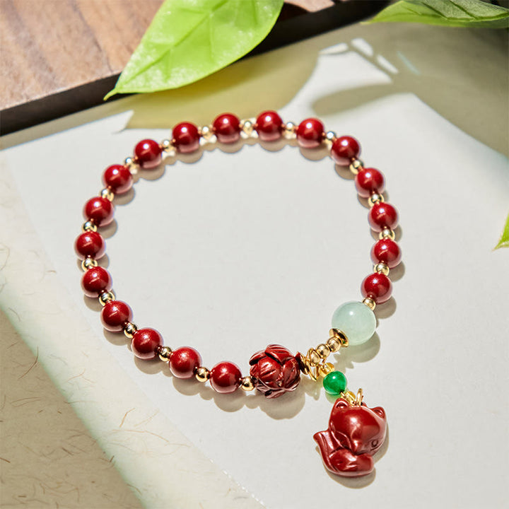 Pulsera con dije de zorro adorable de loto cinabrio y Buddha Stones