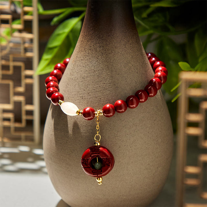 Pulsera con dije de paz y hebilla de cinabrio natural de Buddha Stones