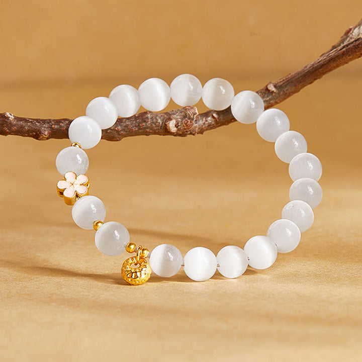 Pulsera de la suerte con ojo de gato blanco y flor de melocotón de plata de ley 925 con Buddha Stones - image 1