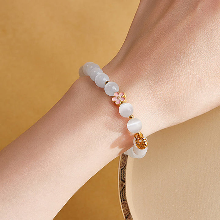 Pulsera de la suerte con ojo de gato blanco y flor de melocotón de plata de ley 925 con Buddha Stones - image 11