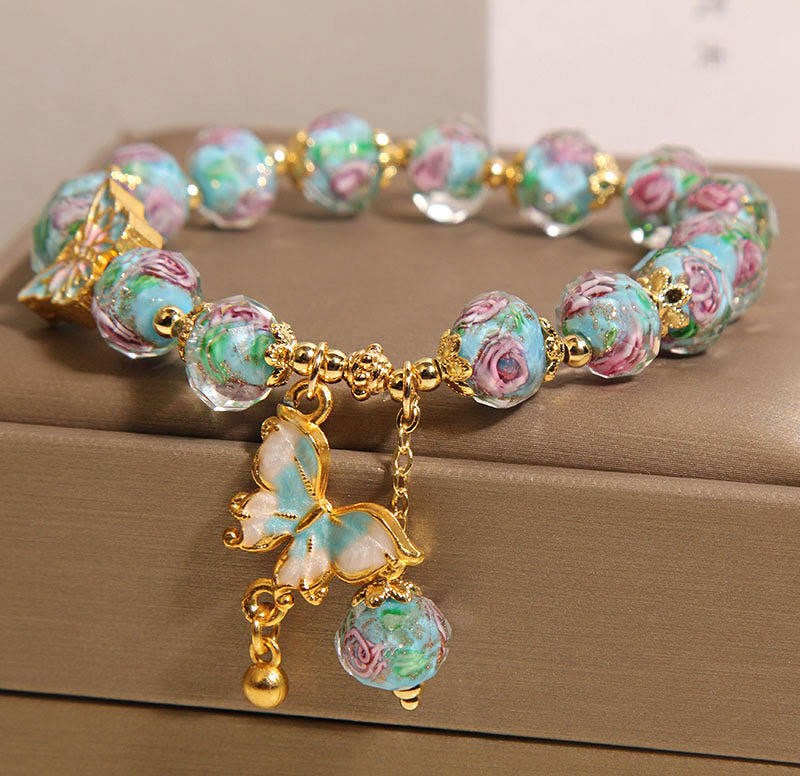 Pulsera Liuli con dije de mariposa y flor rosa de Buddha Stones - image 2