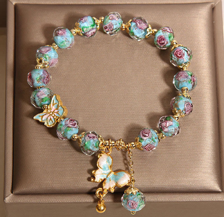 Pulsera Liuli con dije de mariposa y flor rosa de Buddha Stones - image 4