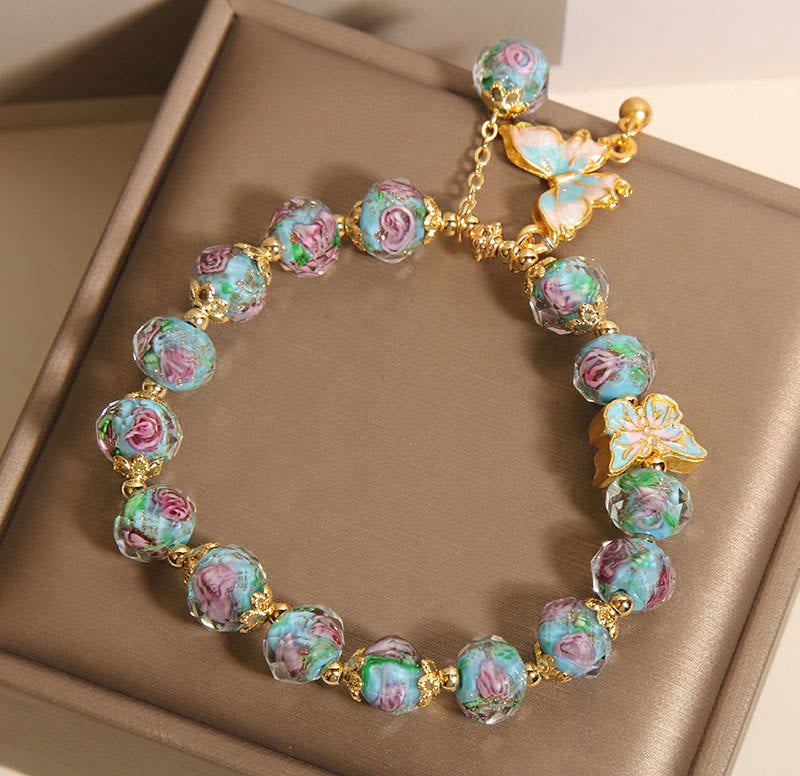 Pulsera Liuli con dije de mariposa y flor rosa de Buddha Stones - image 6