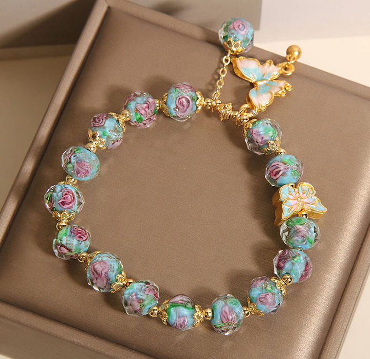 Pulsera Liuli con dije de mariposa y flor rosa de Buddha Stones - image 6