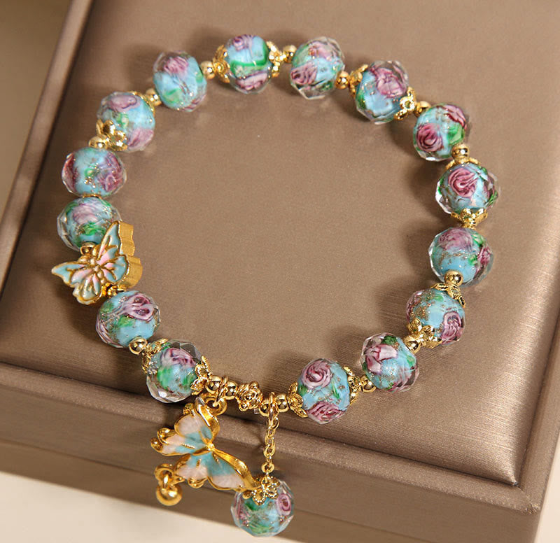 Pulsera Liuli con dije de mariposa y flor rosa de Buddha Stones - image 5