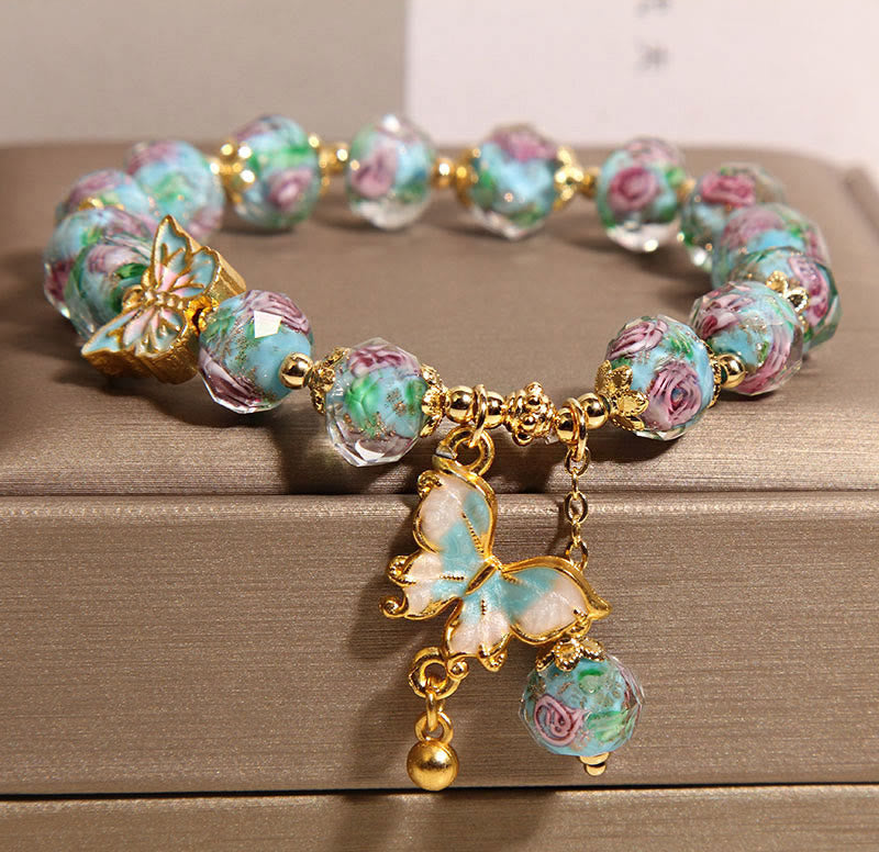 Pulsera Liuli con dije de mariposa y flor rosa de Buddha Stones - image 1