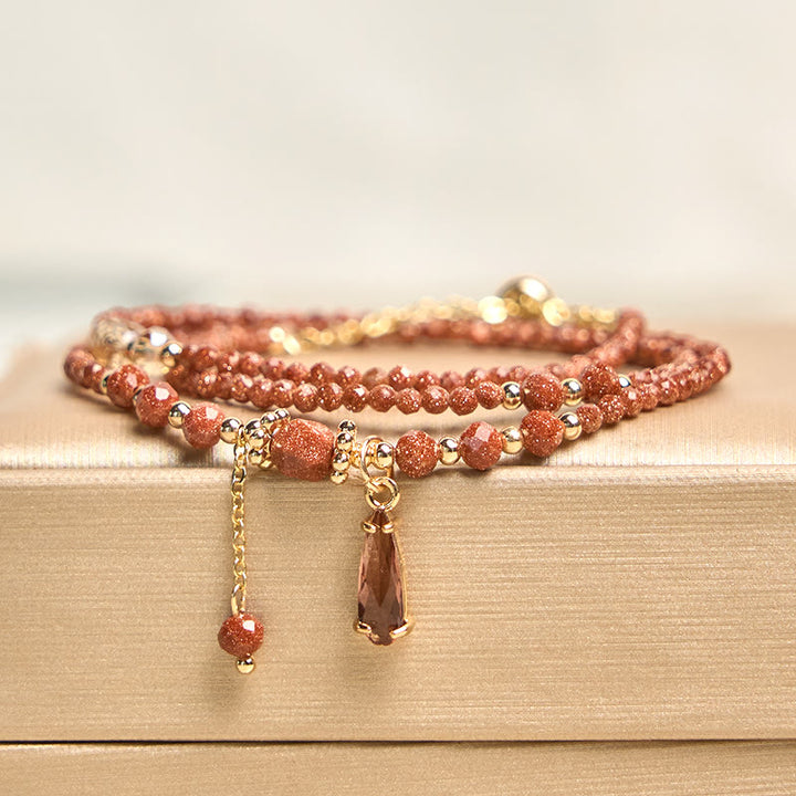 Pulsera multicapa positiva con cuentas de piedra dorada naturales de 2 mm de Buddha Stones