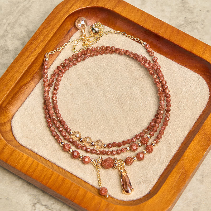 Pulsera multicapa positiva con cuentas de piedra dorada naturales de 2 mm de Buddha Stones