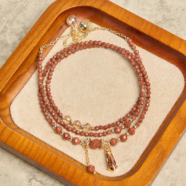 Pulsera multicapa positiva con cuentas de piedra dorada naturales de 2 mm de Buddha Stones
