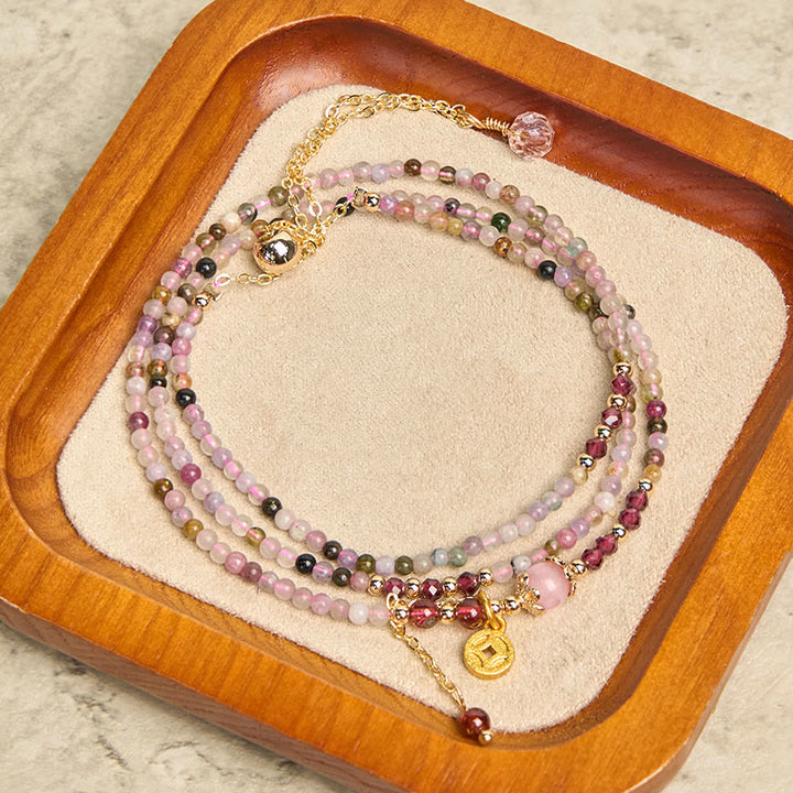 Pulsera de la sabiduría con monedas de turmalina de colores y cuentas irregulares de 2,5 mm de Buddha Stones