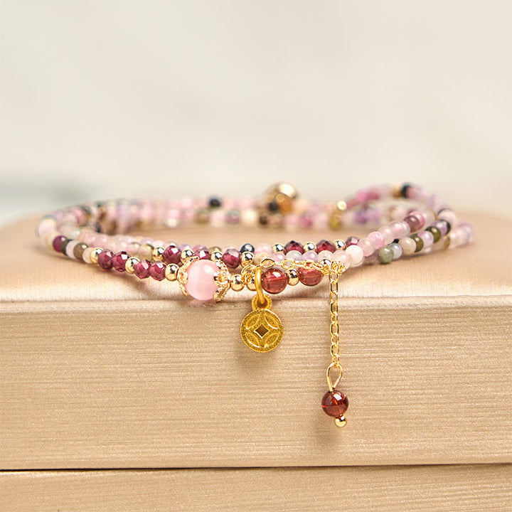 Pulsera de la sabiduría con monedas de turmalina de colores y cuentas irregulares de 2,5 mm de Buddha Stones
