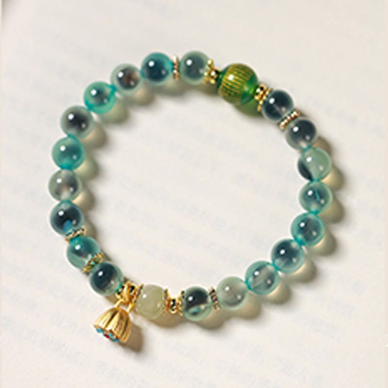 Pulsera curativa con vaina de loto dorado y ágata de caramelo natural de Buddha Stones - image 2