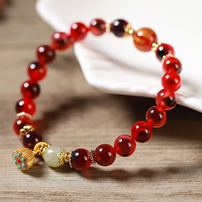 Pulsera curativa con vaina de loto dorado y ágata de caramelo natural de Buddha Stones - image 18