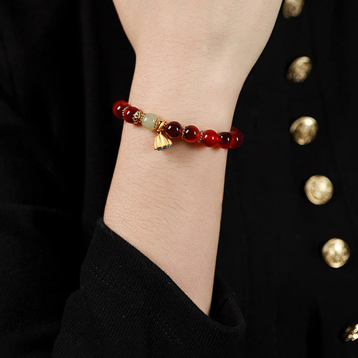 Pulsera curativa con vaina de loto dorado y ágata de caramelo natural de Buddha Stones - image 19