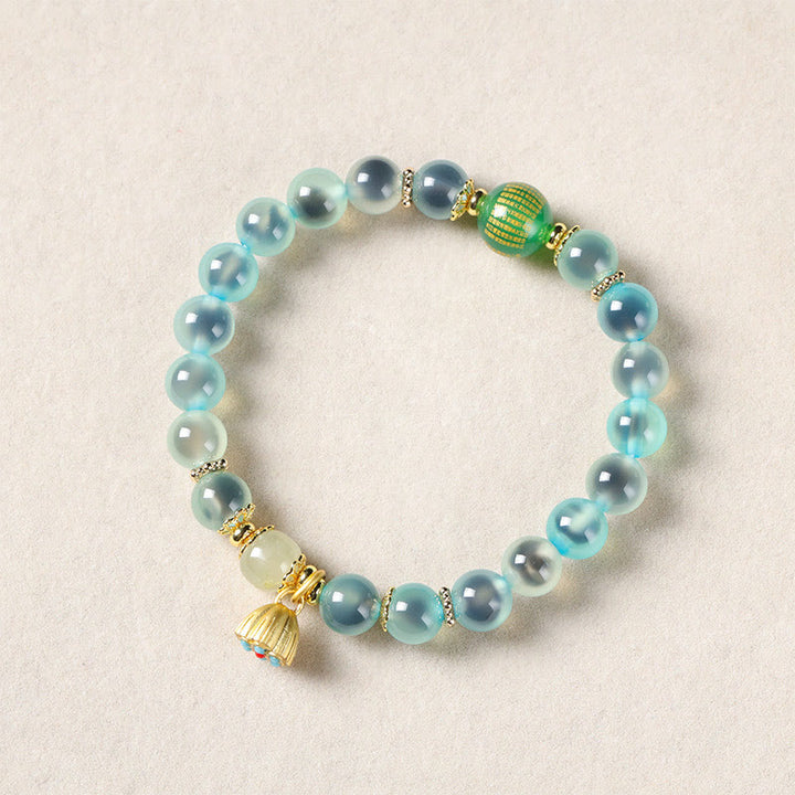 Pulsera curativa con vaina de loto dorado y ágata de caramelo natural de Buddha Stones - image 3