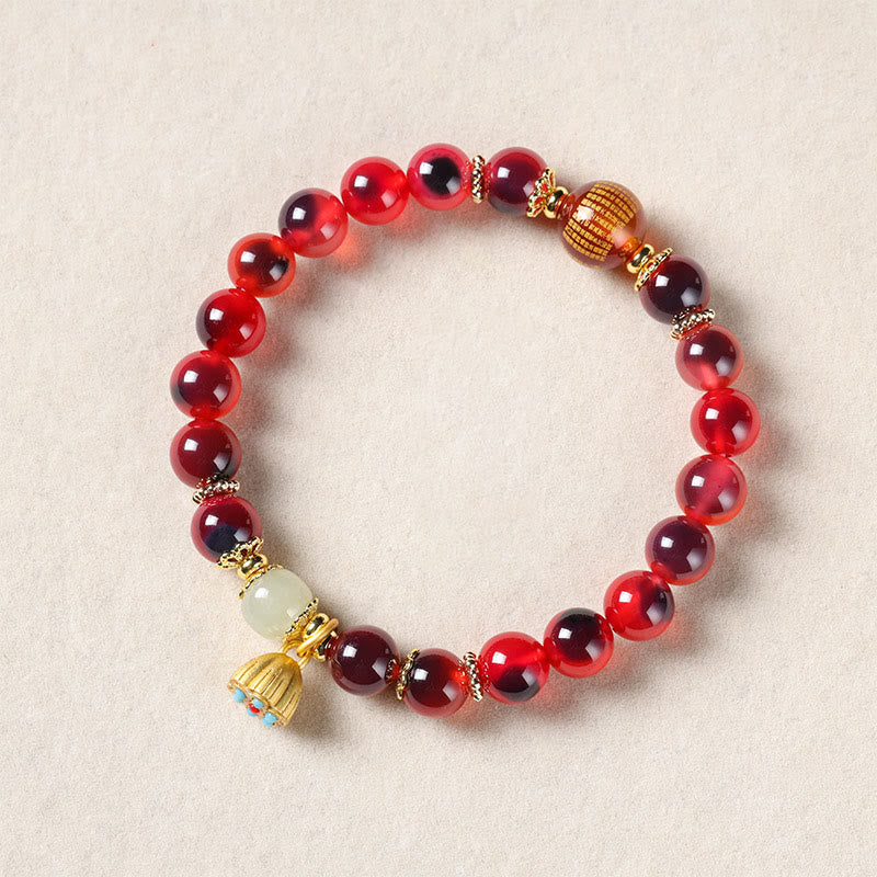 Pulsera curativa con vaina de loto dorado y ágata de caramelo natural de Buddha Stones - image 17