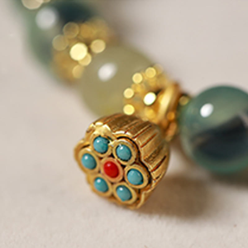Pulsera curativa con vaina de loto dorado y ágata de caramelo natural de Buddha Stones - image 8