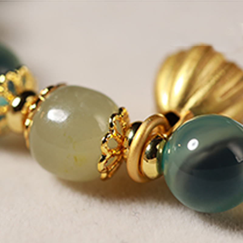 Pulsera curativa con vaina de loto dorado y ágata de caramelo natural de Buddha Stones - image 7