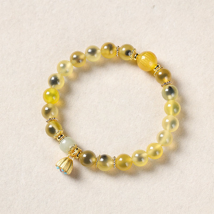 Pulsera curativa con vaina de loto dorado y ágata de caramelo natural de Buddha Stones - Ágata de caramelo amarilla (circunferencia de la muñeca: 14-15 cm) - image 9