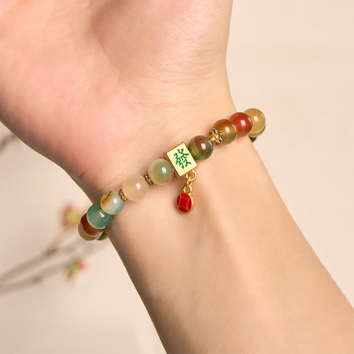 Pulsera de coraje con moneda de ágata pavo real natural de Buddha Stones