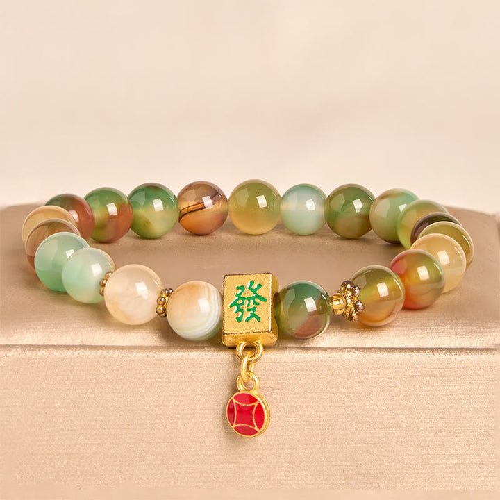Pulsera de coraje con moneda de ágata pavo real natural de Buddha Stones