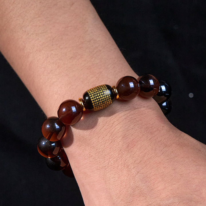 Pulsera de coraje en sánscrito con obsidiana de hielo y Buddha Stones con sello dorado