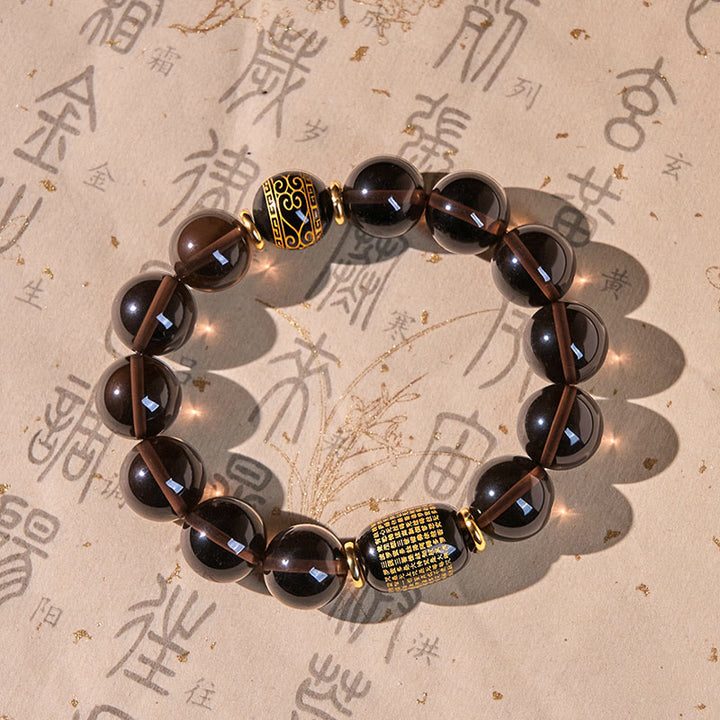 Pulsera de coraje en sánscrito con obsidiana de hielo y Buddha Stones con sello dorado