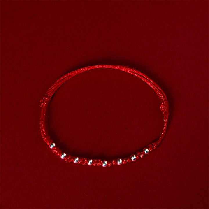 Pulsera de la suerte ajustable con cuentas de hilo rojo de plata de ley 925 y Buddha Stones - image 1