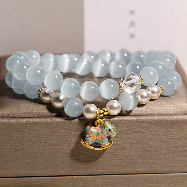 Pulsera de doble vuelta con dije de caballo de Troya y ojo de gato azul de Buddha Stones - image 4