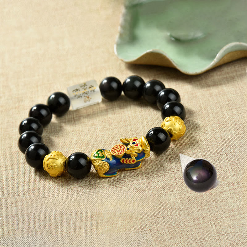 Pulsera de la riqueza con cuentas de obsidiana arcoíris de cobre Pixiu y Buddha Stones Feng Shui - Personaje Om Mani Padme Hum y Fu y Pixiu que cambia de color (circunferencia de la muñeca: 18-19 cm) - image 1