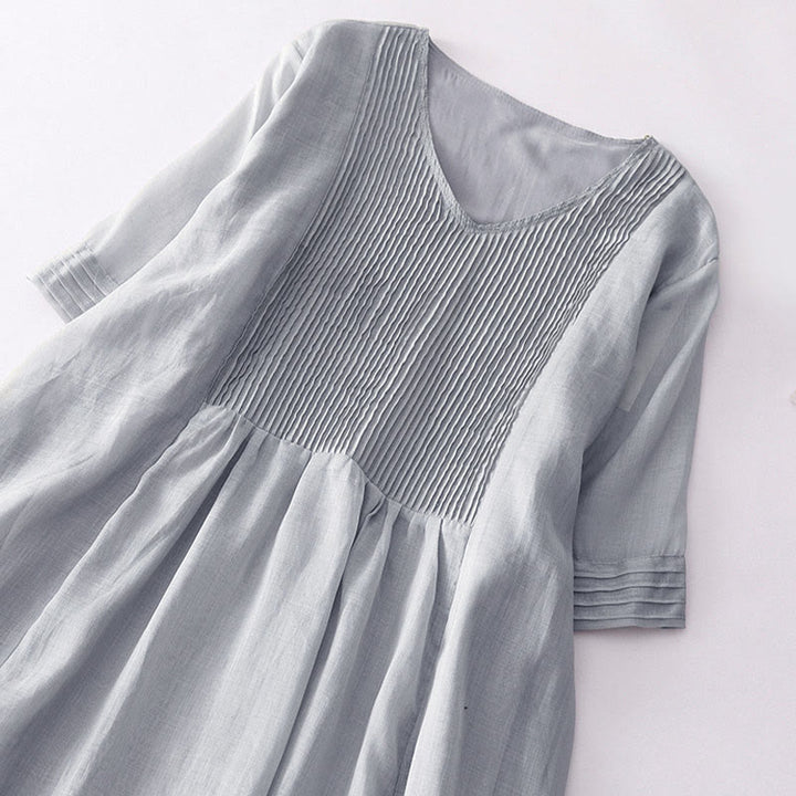 Vestido midi informal de manga corta con cuello en V, pliegues tipo acordeón y bolsillos, con estampado de Buddha Stones. - image 20