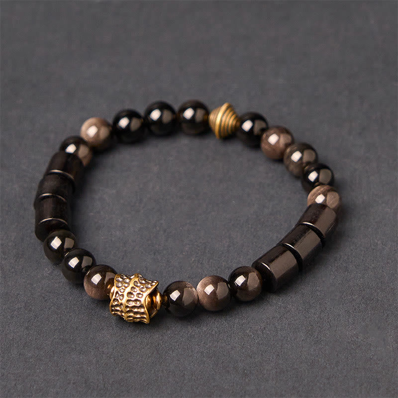 Pulsera protectora de obsidiana y ébano con brillo plateado de Buddha Stones - Obsidiana plateada y madera de ébano (circunferencia de la muñeca: 18-20 cm) - image 0