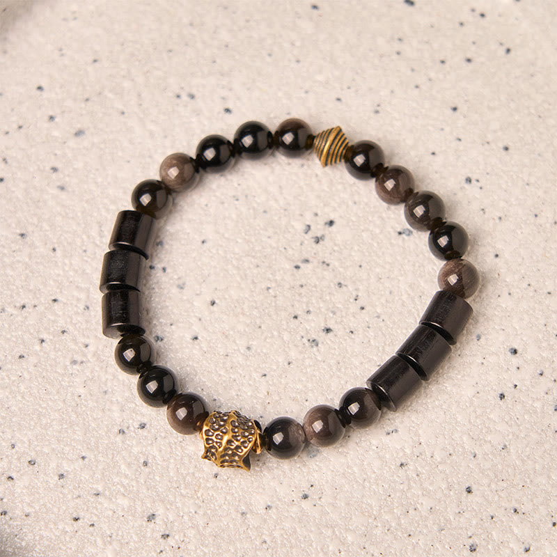 Pulsera protectora de obsidiana y ébano con brillo plateado de Buddha Stones - image 1