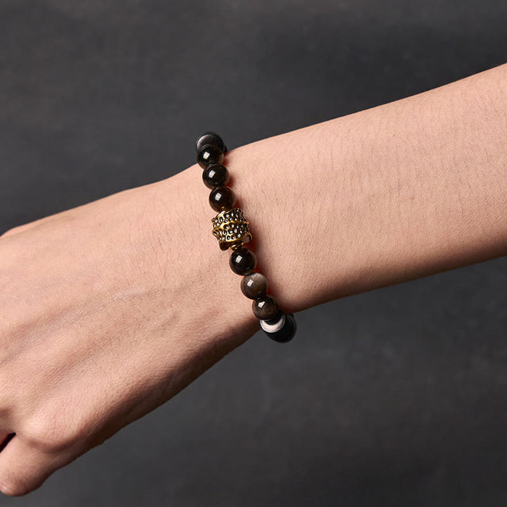 Pulsera protectora de obsidiana y ébano con brillo plateado de Buddha Stones - image 4