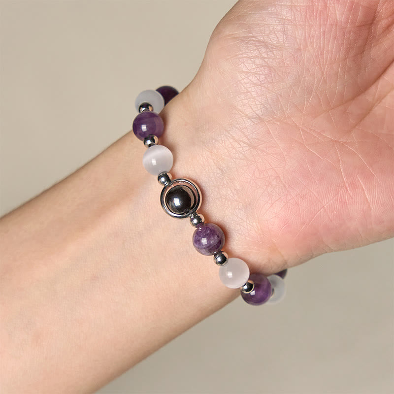Pulsera de equilibrio con cuentas de ojo de gato blancas y amatista natural de Buddha Stones - image 3