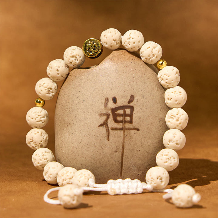 Pulsera de piedra de lava blanca con símbolo Om y Buddha Stones para la calma y la curación - image 1