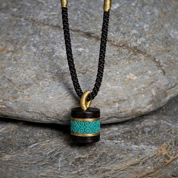 Collar con colgante de paz con cilindro de turquesa y madera de ébano con Buddha Stones - image 1