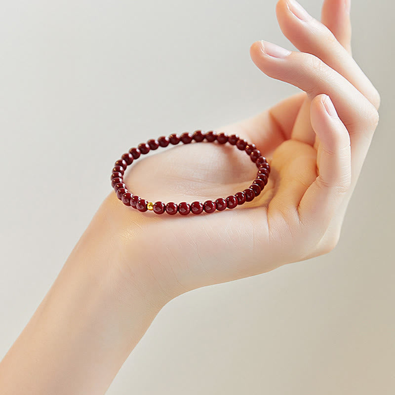 Pulsera de concentración con diseño simple de cinabrio y oro 999 de Buddha Stones - image 1