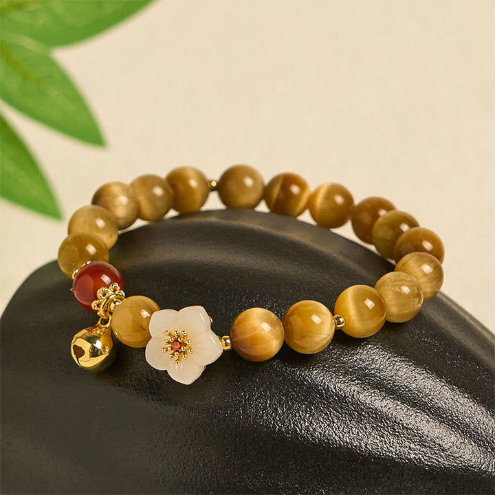 Pulsera de coraje con flor de campana y ojo de tigre dorado natural de Buddha Stones - image 1