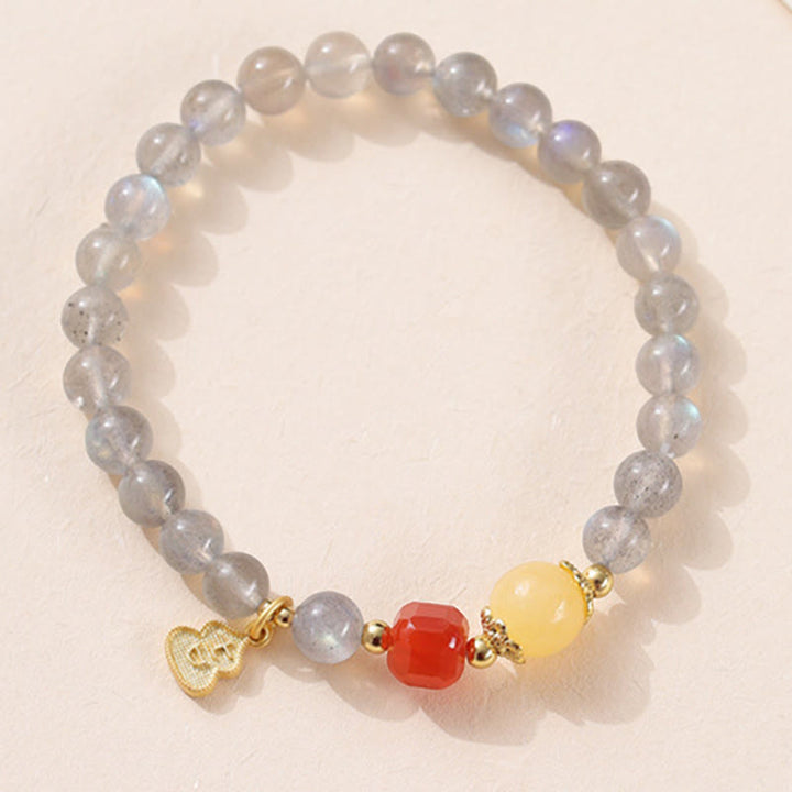 Pulsera con encanto de loto, piedra lunar natural y Buddha Stones - image 11