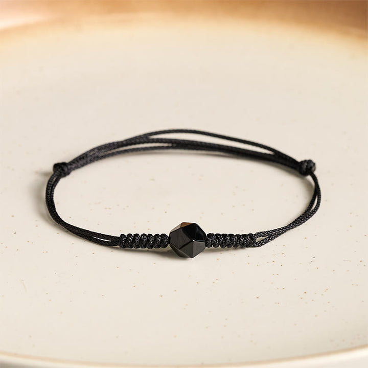 Pulsera de fuerza trenzada con hilo de obsidiana negra natural y Buddha Stones - image 1