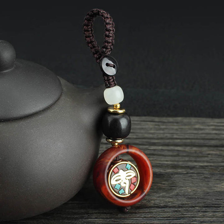 Llavero giratorio con Buddha Stones, madera de ébano, trébol de cuatro hojas en sánscrito, ojo de Buda y paz. - Patrón de ojo de Buda - image 6