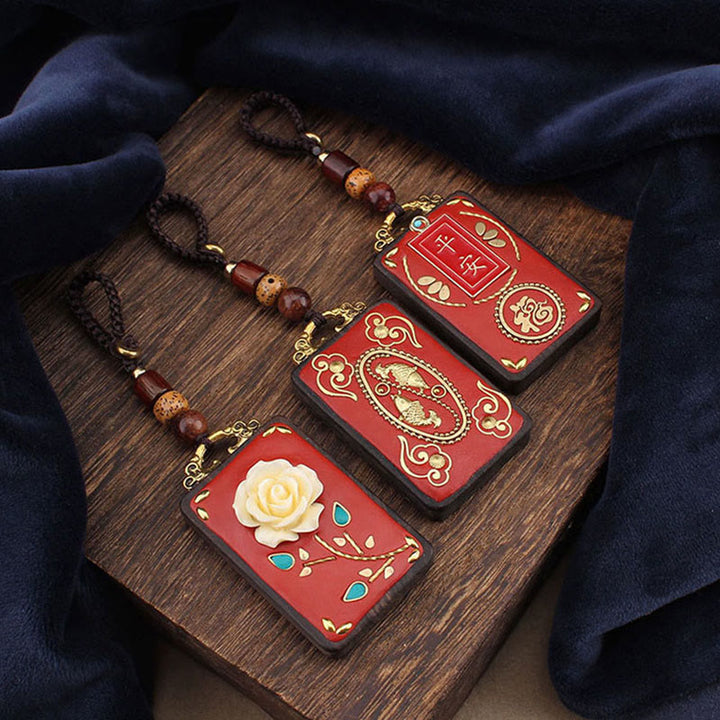 Buddha Stones Llavero con botón de flor de ébano, pez koi y carácter chino de la suerte con cuerda - image 0