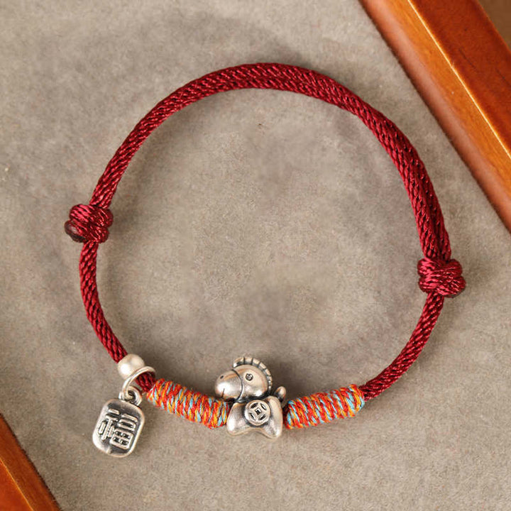Pulsera trenzada con Buddha Stones en plata de ley 999 con el personaje Fu del Año del Caballo. - image 0