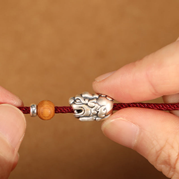 Pulsera tobillera trenzada hecha a mano con cuentas de madera de melocotón y dije de Pixiu de Buddha Stones en plata de ley 999. - image 5