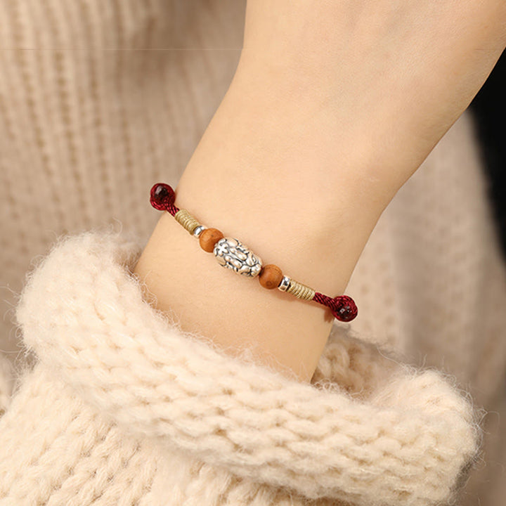 Pulsera tobillera trenzada hecha a mano con cuentas de madera de melocotón y dije de Pixiu de Buddha Stones en plata de ley 999. - image 10