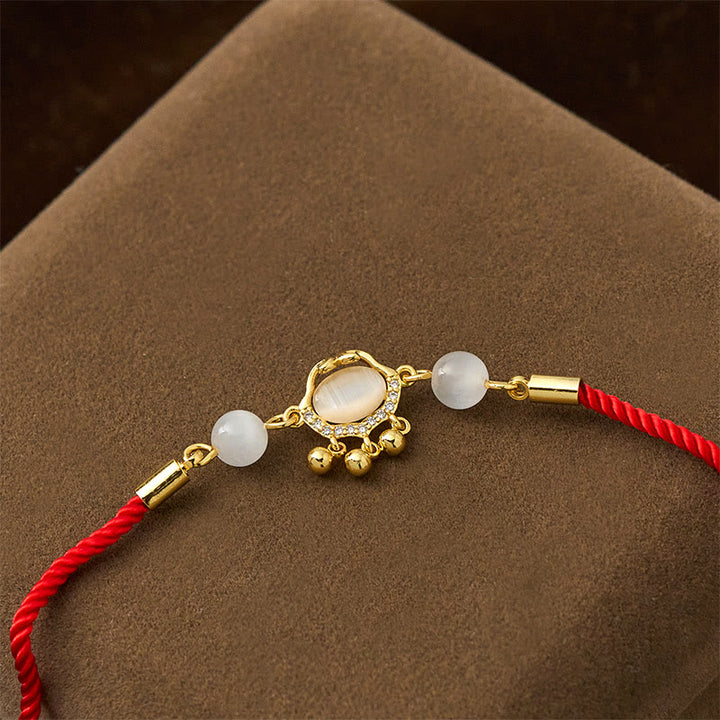 Pulsera protectora chapada en oro y cobre con abalorio de ojo de gato y Buddha Stones - image 3